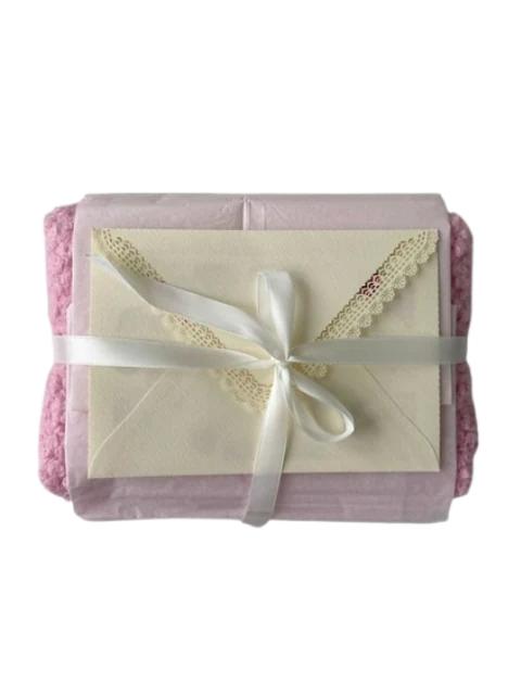 A wrapped pink gift box