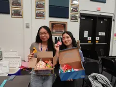Vivian and Grace Han with origami collected after a workshop