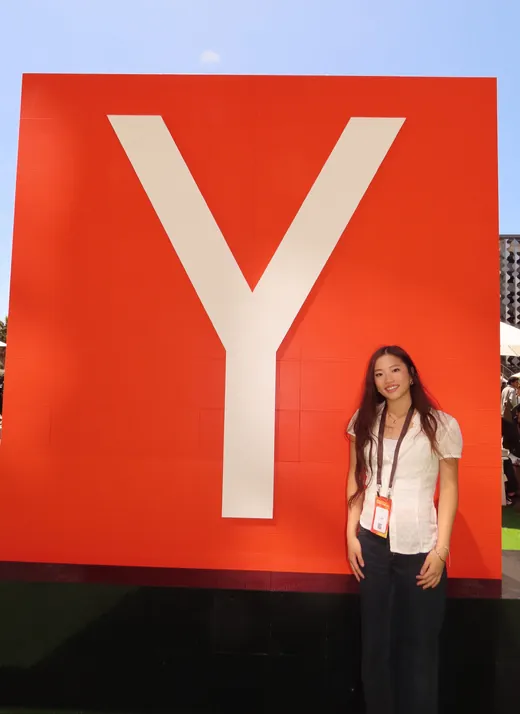 Vivian Liu in front of the Y Combinator sign at Startup School 2026 in San Francisco